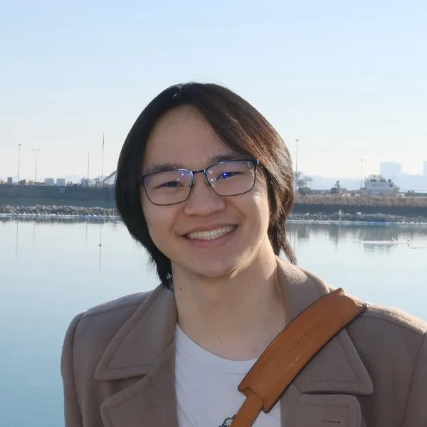 Alan smiling at the camera in the New York Public Library